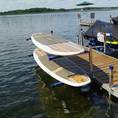 Paddleboards hanging on Kayak Rack by ShoreMaster